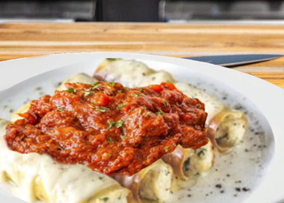 A plate of food with meat and sauce on it.