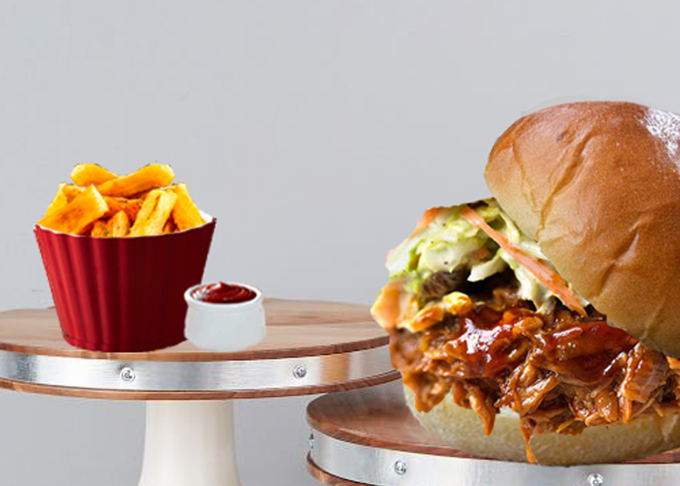 A close up of a sandwich and fries on a table