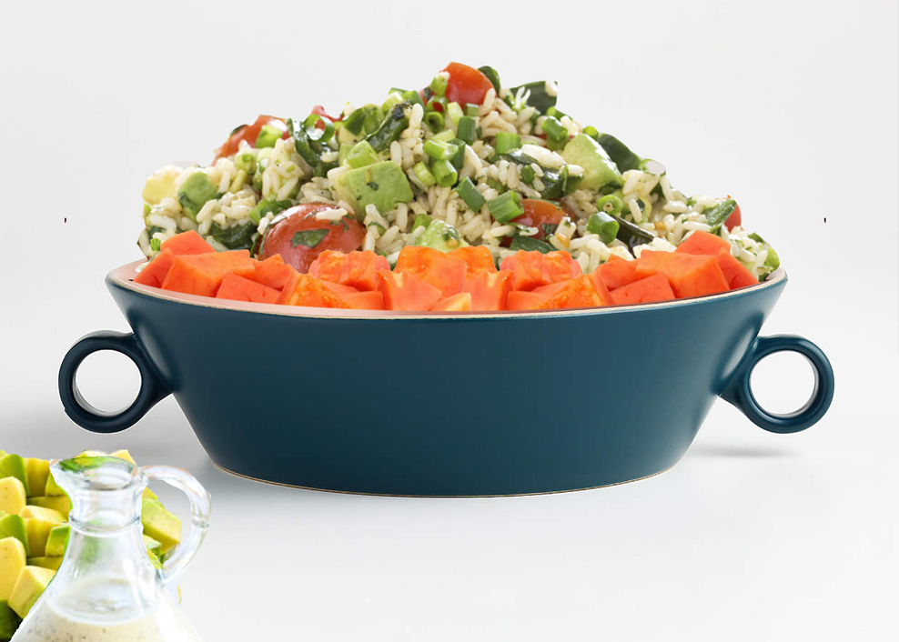 A bowl of rice and vegetables on top of the table.