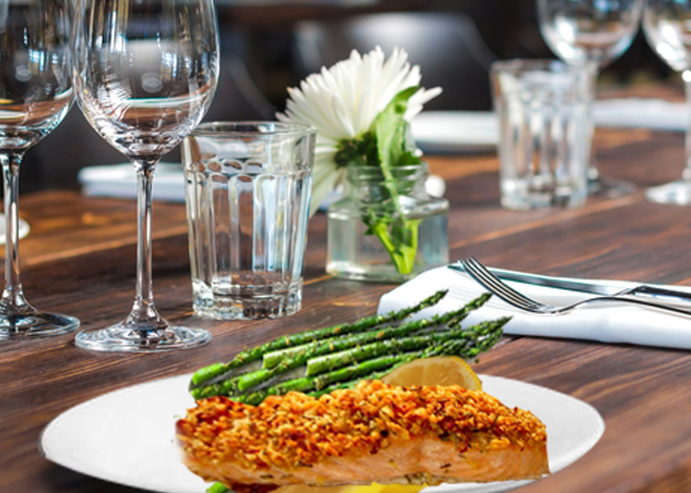 A plate of food on top of a wooden table.