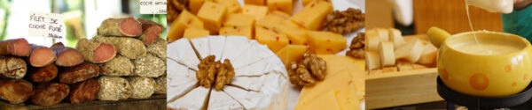 A cheese platter with nuts and cheeses on the side.