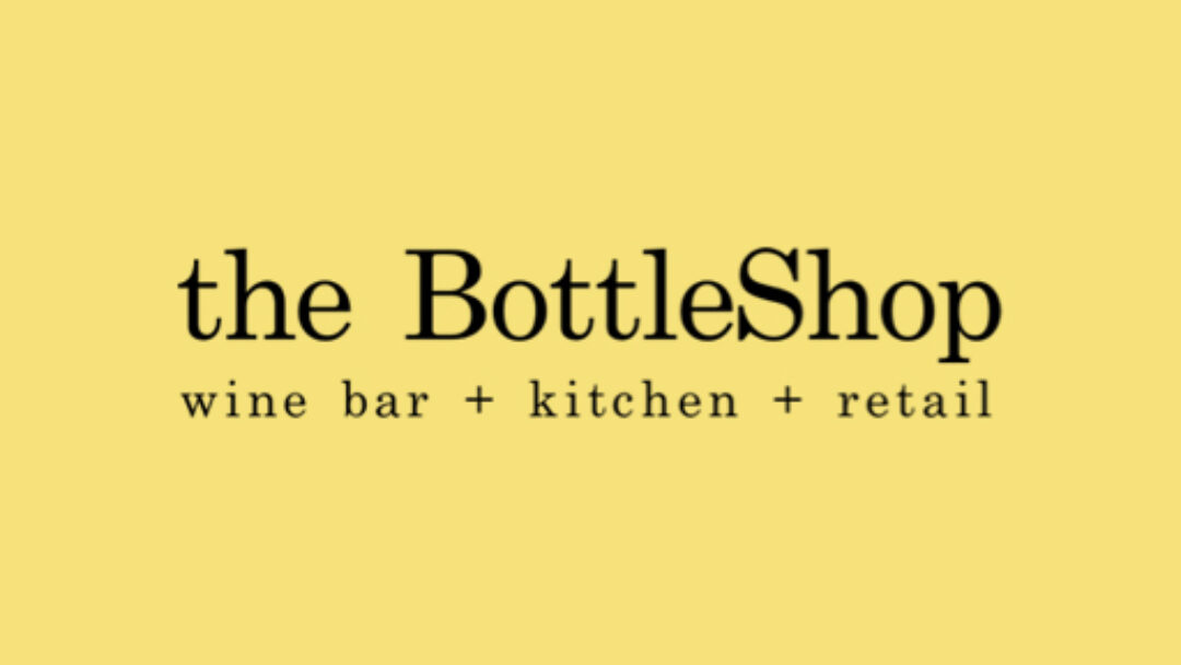 A yellow background with the words " the bottleshop " in black.