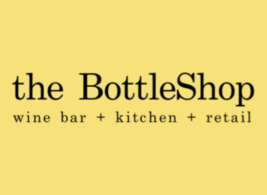 A yellow background with the words " the bottleshop " in black.