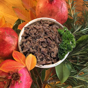 A bowl of food on top of some leaves